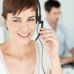 A happy smiling call center worker looking at the camera.